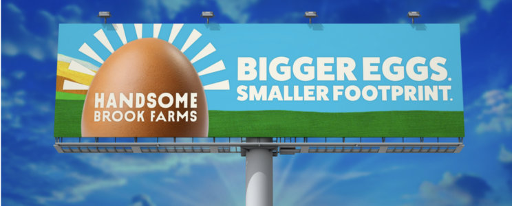 Highway billboard reading "Bigger eggs, smaller footprint."